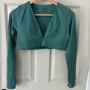 Garage clothing store turquoise cropped long sleeve v shaped ribbed top